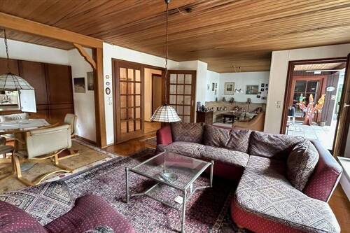 Wohnzimmer mit Zugang zum Wintergarten - 