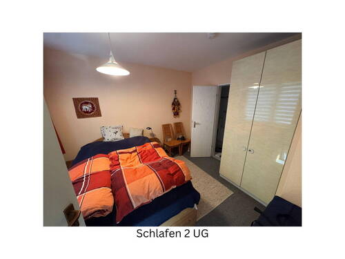 Schlafzimmer 1 im UG - 