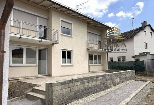 Ansicht Terrasse - Erdgeschosswohnung mit Terrasse und Gartenzugang