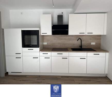 EBK - Wohlfühlwohnung mit Balkon und moderner Ausstattung im Erstbezug! Rollstuhlgerecht!