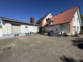 Hofansicht - 1 Zimmer Mehrfamilienhaus, Wohnhaus in Hille