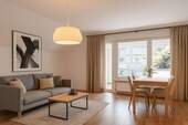 200-8394_Wohnzimmer_a_gestaged - Etagenwohnung mit 82,50 m² in Elmshorn zum Kaufen