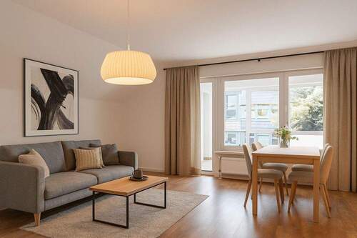200-8394_Wohnzimmer_a_gestaged - Etagenwohnung mit 82,50 m² in Elmshorn zum Kaufen