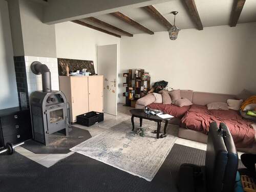 Wohnzimmer mit Kamin EG - 