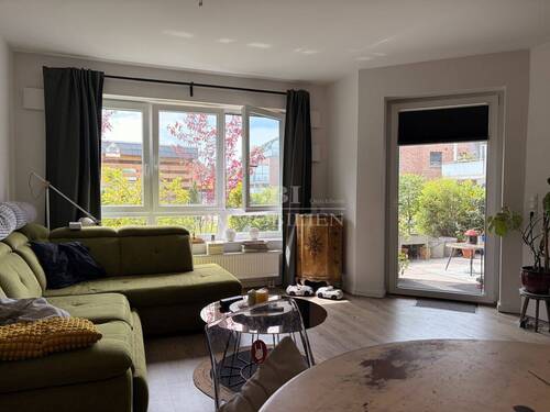 Wohnzimmer mit Zugang zur Terrasse - Etagenwohnung mit 97,00 m&sup2; in Quickborn zur Miete