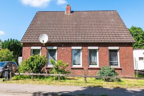 Außenansicht Front - Obstbäume, Freiraum und unzählige Möglichkeiten - Einfamilienhaus auf großem Grundstück in Kehdingbruch!