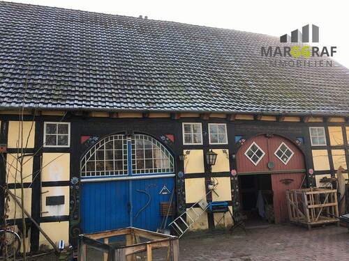 Front mit Doppeldeelentor - Mehrfamilienhaus, Wohnhaus mit 273,00 m² in Melle / Hoyel zum Kaufen