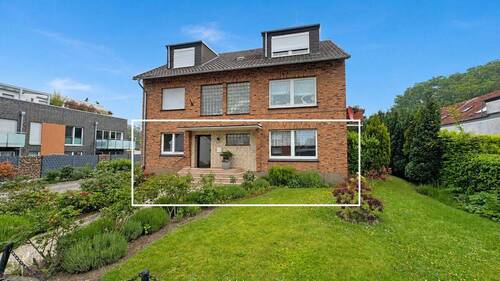 Frontansicht - Komfortable Erdgeschosswohnung mit Terrasse, Kamin und großem Gemeinschaftsgrundstück in Spellen!