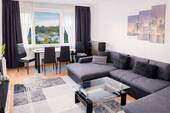 modernes Wohnzimmer mit Essbereich -2 - Licht, Luft und Lebensqualität - Attraktive Wohnung mit Balkon