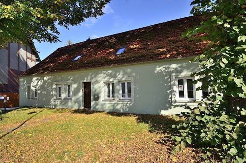 Hausansicht - Einfamilienhaus auf ideell geteilten Grundstück mit Wasserzugang