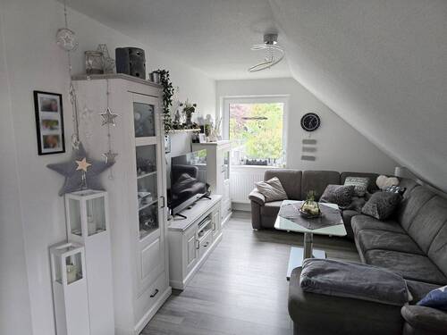 Wohnzimmer der linken Oberwohnung - 