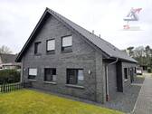 rückwärtige Ansicht - Mehrfamilienhaus, Wohnhaus zum Kaufen in Uplengen / Großoldendorf