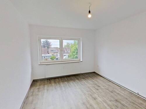 Ansicht I: Wohn- und Esszimmer - Großzügig geschnittene 3-Zimmer-Wohnung mit EBK und Wannenbad im Norden von Bordesholm