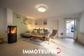 Wohnzimmer mit Zugang zur Terrasse - 