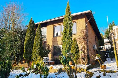 00_Haus_back - Charmantes Einfamilienhaus mit Einliegerwohnung und Weitblick in Ostercappeln!