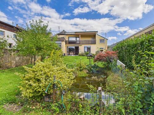 Rückansicht - 6 Zimmer Mehrfamilienhaus, Wohnhaus zum Kaufen in Irrel