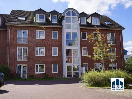 Objektansicht - Terrasse und Tiefgarage inklusive: Solide Erdgeschosswohnung mit verlässlicher Miete