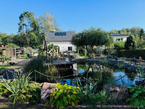 Gartenansicht - Mehrfamilienhaus, Wohnhaus mit 105,00 m² in Petershagen/Eggersdorf zum Kaufen