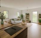 Wohn-/Essbereich visualisiert - Wunderschöne 3-Zimmer-Neubauwohnung mit Garten, Balkon und Küche