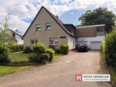 Objektansicht - 6 Zimmer Mehrfamilienhaus, Wohnhaus zum Kaufen in Wiefelstede