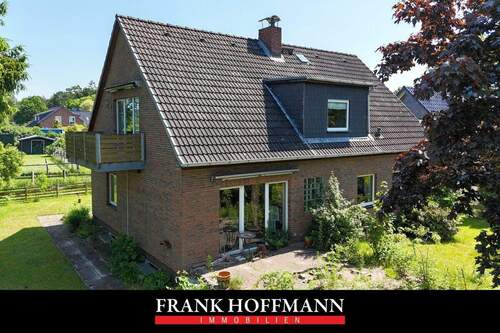 Titelbild V7482 - Teilvermietetes Einfamilienhaus mit Einliegerwohnung in schöner Lage von Hartenholm