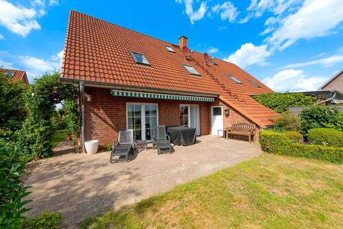 Terrasse mit Markise und Abstellraum - 