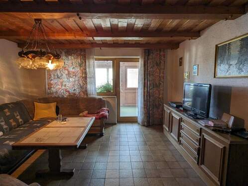 Wohnzimmer mit Zugang zum WiGa - 