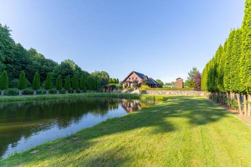 Garten und Teich - Einzigartige Oase: Stilvolles Einfamilienhaus mit privatem Teich auf ca. 3.400 m² Grundstück