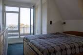 Schlafzimmer mit Zugang zur Dachterrasse - 
