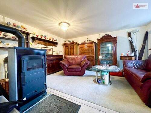 Wohnzimmer mit Dauerbranndofen EG - 