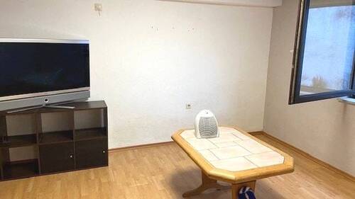 Wohnzimmer im Erdgeschoss - Mehrfamilienhaus, Wohnhaus mit 159,00 m² in Renchen zum Kaufen