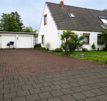 Charmante Doppelhaushälfte mit Wintergarten, großem Grundstück & viel Potenzial in Bremen