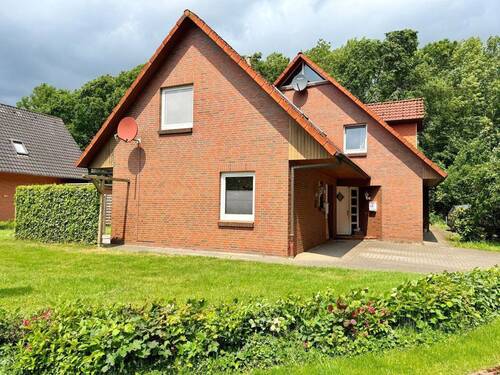 Seitenansicht - 6 Zimmer Mehrfamilienhaus, Wohnhaus zum Kaufen in Großenkneten