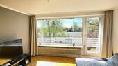4 Das helle Wohnzimmer mit Tür zum Balkon.jpeg - Terrassenwohnung mit 57,00 m&sup2; in Winsen (Luhe) zum Kaufen