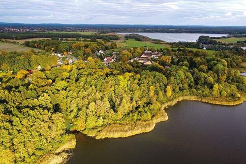 Luftaufnahme von links - Baugrundstück mit Waldbestand am Großen Schauener See