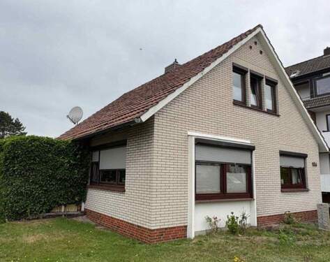 Bild 1 - Einfamilienhaus mit Garten und Garage