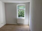 Schlafzimmer mit Laminat - 