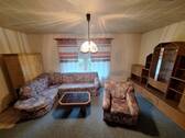 Wohnzimmer mit Kamin - Einfamilienhaus mit 68,00 m&sup2; in Friedland zum Kaufen