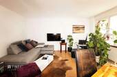 Wohnzimmer - Terrassenwohnung mit 55,00 m² in München zum Kaufen