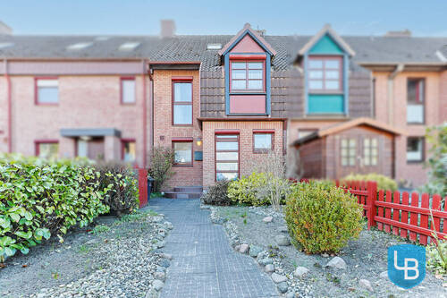Hausansicht - Gepflegtes Reihenmittelhaus mit sonnigem Garten, Einzelgarage und attraktivem Entwicklungspotenzial
