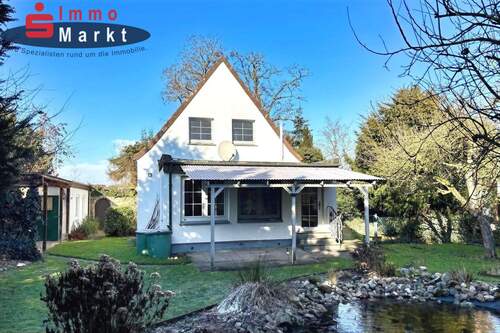 Titelbild - Harmonisches Einfamilienhaus mit idyllischem Garten in bester Lage!