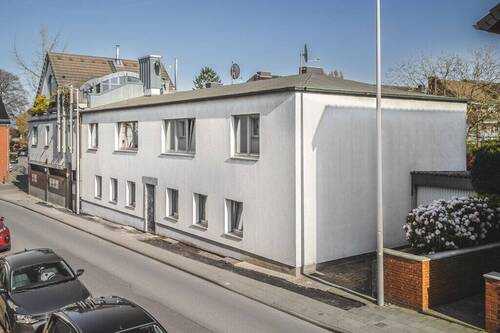 Titelbild - Vermietetes 4-Parteienhaus mit Garten und Garage