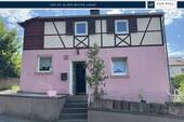 Titel A__8b63d11b-0ba0-4ff2-b527-c889f7882b1d - Verkauf: Schnuckeliges Einfamilienhaus mit Weitblick und Sanierungsbedarf in Höhenlage von Höchberg