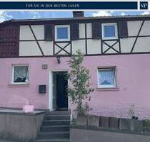 Verkauf: Schnuckeliges Einfamilienhaus mit Weitblick und Sanierungsbedarf in Höhenlage von Höchberg