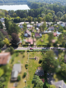 Luftbildlogo - Ihr gemeinsamer Wohntraum am Summter See - zwei Familien, ein Grundstück, unendliche Möglichkeiten.