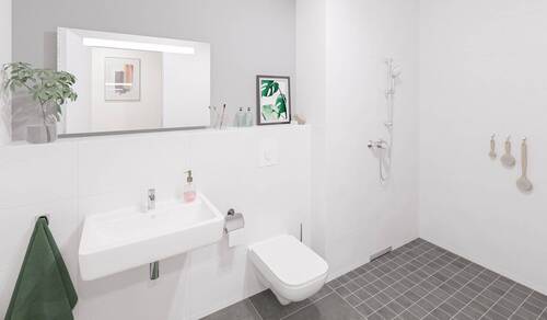 Ein modern gefliestes Badezimmer mit bodengleicher - Etagenwohnung mit 62,90 m² in Hasloh zum Kaufen