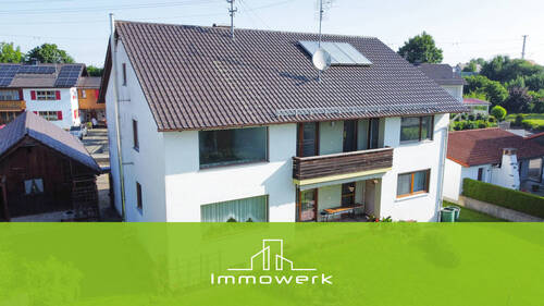 Titelbild - Attraktiv für Eigennutzer und Anleger: großzügige OG-Wohnung mit Garten und zwei Garagen