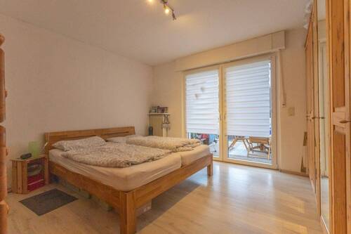 Schlafzimmer mit Zugang zum Wintergarten - Wohnung im EG - 