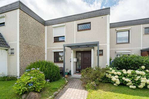 Ansicht - Gemütliches Mittelreihenhaus in ruhiger Lage mit Einzelgarage und Keller