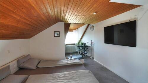 Eines der Zimmer in der oberen Wohnebene Hauptwohnung - 